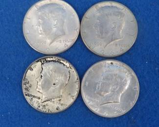 Lot 422. Four 1964 silver Kennedy half dollar coins