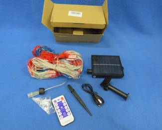 Lot 268. Solar-powered American flag. New-in-the-box.