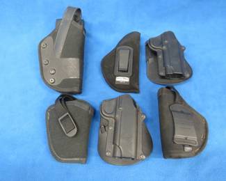 Lot 311. Six holsters: Blackhawk size 8, Two Fobus size -21, Three Uncle Mike's Sizes 12, 20, and 36.