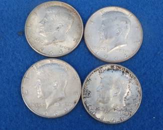 Lot 426. Four 1964 silver Kennedy half dollar coins