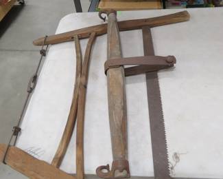 Lot 131. Vintage bucksaw and evener.