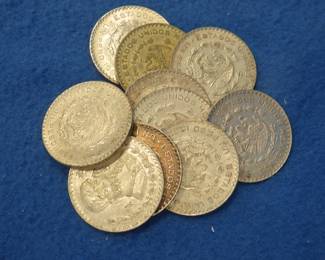 Lot 53. Ten Mexican one peso 10% silver coins. Dates range from 1957-1967.