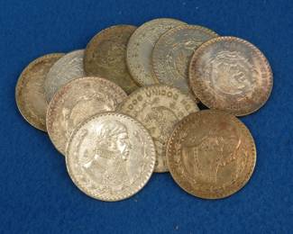 Lot 52. Ten Mexican one peso 10% silver coins. Dates range from 1957-1967.
