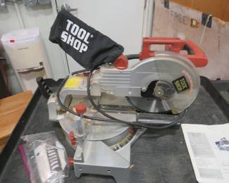Lot 71. Tool Shop 10" sliding compound miter saw with laser guide. Works. Includes manual.