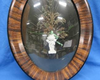 Lot 109. Oval frame shadow box