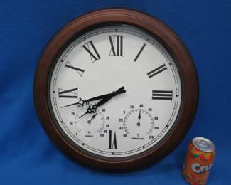 Lot 48. Battery-operated clock with temperature and humidity gauges