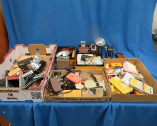 Lot 467. Two big boxes of vintage cameras, equipment, and supplies