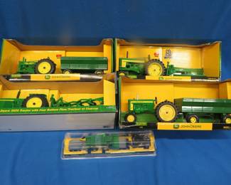 Lot 466. Four John Deere NOS die-cast tractors and more