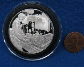 Lot 114. 1973 Postmasters of America sterling silver medallion. Total coin weight 25.3 grams.