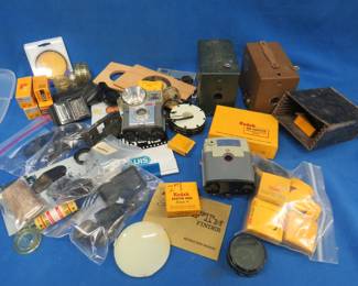 Lot 433. Vintage and newer cameras and equipment. Includes unexposed film.