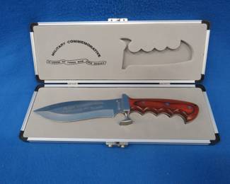 Lot 261. Military Commemorative knife in a hard case. Mint condition.