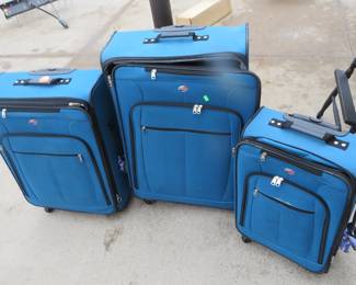 Lot 197. Three blue American Tourister suitcases