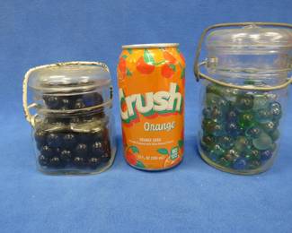Lot 294. Two glass locking lid canning jars with decorative/crafting marbles
