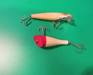 Lot 34. Vintage Paw Paw 4 1/4" wooden Pike Series 1000 with tack eyes, and an unidentified 2 3/4" wooden plunker