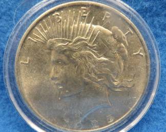 Lot 59. 1925 P Peace silver dollar