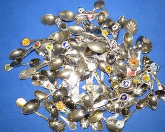 Lot 274. Over 90 souvenir spoons from around the world. Includes cherub flower vase.