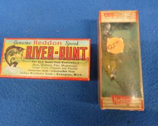 Lot 283. Like new Heddon 2 1/2" Spook Sinker and a Heddon 3" Spook Floater with a vest pocket catalog. Both are in their original boxes.
