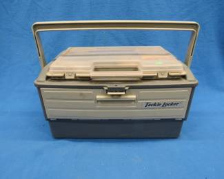 Lot 479. "Tackle Locker" tackle box full of tackle including Red Eye, Zebco Super secret in the box, Wooden plunker, Jitterbug, Salmon plug, and more.