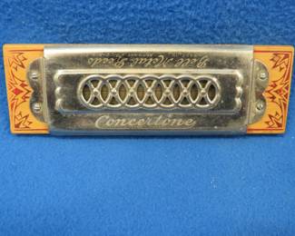 Lot 297. Vintage Concertone Bell tremolo harmonica with metal reeds in the key of C. Probablymade by Koch.