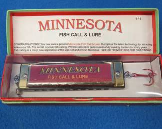 Lot 315. Minnesota Fish Call & Lure harmonica appears NIB. Novelty only. Does not have sound in all holes.
