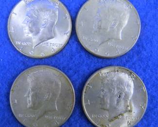 Lot 257. Four 1964 Kennedy half dollars. 90% silver.