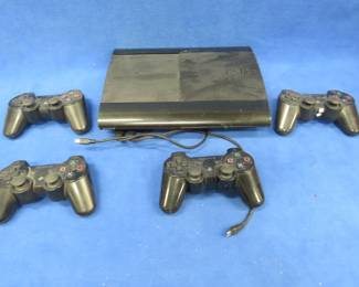 Lot 430. Sony PlayStation 3 (PS3) with four controllers. Tested and working.