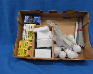 Lot 124. Light bulbs, scouring pads, and Magic sponges