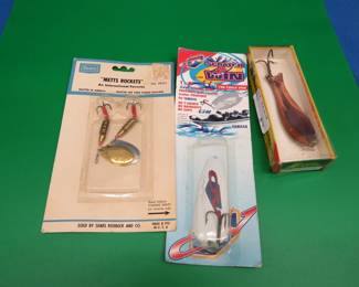 Lot 383. Three NIP baits: Metts Rockets. (Note: not a "Mepps" -- what a dirty trick), McDonald Lif-Lik Lures, Hugger Old Vienna spoon.
