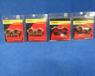 Lot 313. Four new-in-the-package Traditions 1" scope ring sets. Two camo aluminum A791BU and two gloss black aluminum A797.