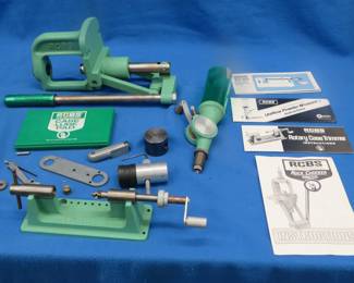 Lot 443. RCBS Precissioneered Rock Chucker Press, Rotary case Trimmer, Uniflow Powder measure and other reloading equipment.
