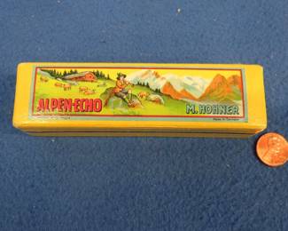 Lot 295. Vintage Hohner Alpen-Echo tremolo harmonica in the yellow box in the key of C. Harmonica and box are both in excellent condition.