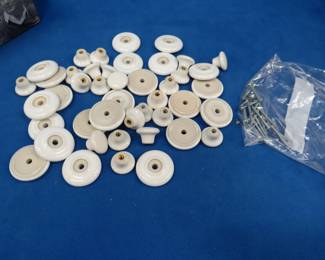 Lot 410. Porcelain drawer pulls with fasteners
