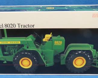 Lot 24. Ertl Precision Classic RC2 Model 8020 John Deere Tractor. Never been out of its foam shell. 1/16 scale. Includes booklet and coin.