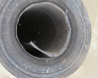 Lot 207. Roll of tar paper and some 80-grit sandpaper