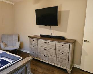 Dresser, rocking chair, television