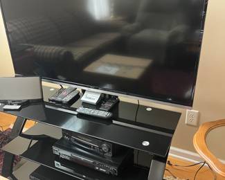 Nice modern glass and silver metal three shelf tv stand