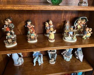 Back row left to right
*Hummel, To Market #49/0 figurine
*Hummel, Puppy Love figurine
*Hummel, Max and Moritz #123
*Hummel, Doll Doctor #127
*Hummel, Stormy Weather #71
FROM LEFT TO RIGHT IN FRONT
*Hummel, Wayside Harmony #111
*Hummal, Just Resting #112
*Hummel, Strum Along #557
*Hummel, Feathered Friends #344
*Hummel, We Congratulate #220
