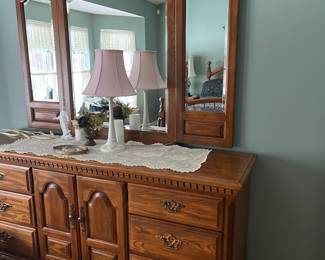Long low dresser with winged mirror