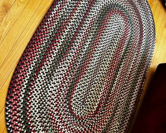 Smaller braided rug, a larger dining room size that matches is also available