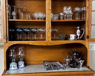 Crystal Wineglasses in an Oak and Ceramic Hutch that matches the Table