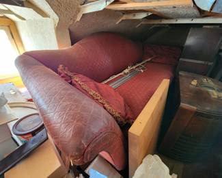 Vintage camelback sofa with embossed leather upholstery 