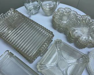 (20pc) Misc. Glassware Set | Miscellaneous set of glassware including: 4 floral-shaped dessert plates
4 square divided/section plates
3 serving platters
3 condiment trays
4 punch glasses
2 harp-shaped dishes


