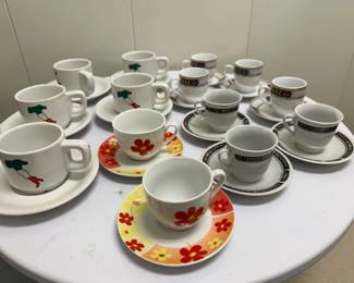 Assortment of Tea Sets & Tray | Assortment of tea set with cups, saucers and lacquered storage box/tray, including: 4 cups, marked "Elegance Japan," large border. 3 cups, marked "Made in China," small border
5 cups, marked "Porcelaine Made in France," Italy
2 cups, marked "New Port," orange flowers - h. 2 in (ea., approx.)
