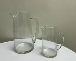 (2pc) Art Glass Pitchers | One large and one small art glass pitchers with "open top" handle and pinched spout.


