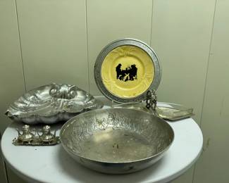 (6pc) Misc. Tinware | Miscellaneous tinware including:
Salt & pepper shakers, Serving bowls, Relish dish, Plate -Salt & pepper: h. 5 in. 
Small bowl: dia. 10.5 in.
Large bowl: dia. 12 in.
Relish dish: dia. 12 in. 
Plate: dia. 11 in. 
