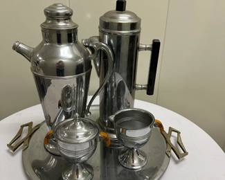 Misc. Coffee Set | Miscellaneous coffee set with metal coffee pitchers, creamer and sugar bowls, and silver tray with handles, including: Tray: l. 15 in. x h. 13.5 in.
Coffee Carafe: h. 13 in.
Coffee Carafe: h. 12.5 in.
Sugar Bowl: h. 5 in.
Creamer: h. 4 in. 

