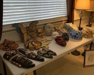 Decorative wooden masks and Tiffany style scones covers