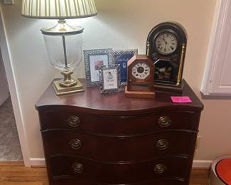 Antique Mahogany chest, brass lamp, frames and antique clocks