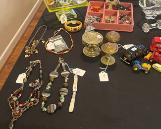 Brass door knobs, some jewelry, uranium glass