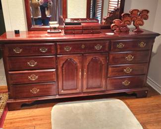 Dresser with brass accents and two mirrors